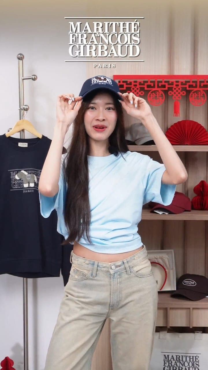 Marithé François Girbaud live: a host styles a cap and tee